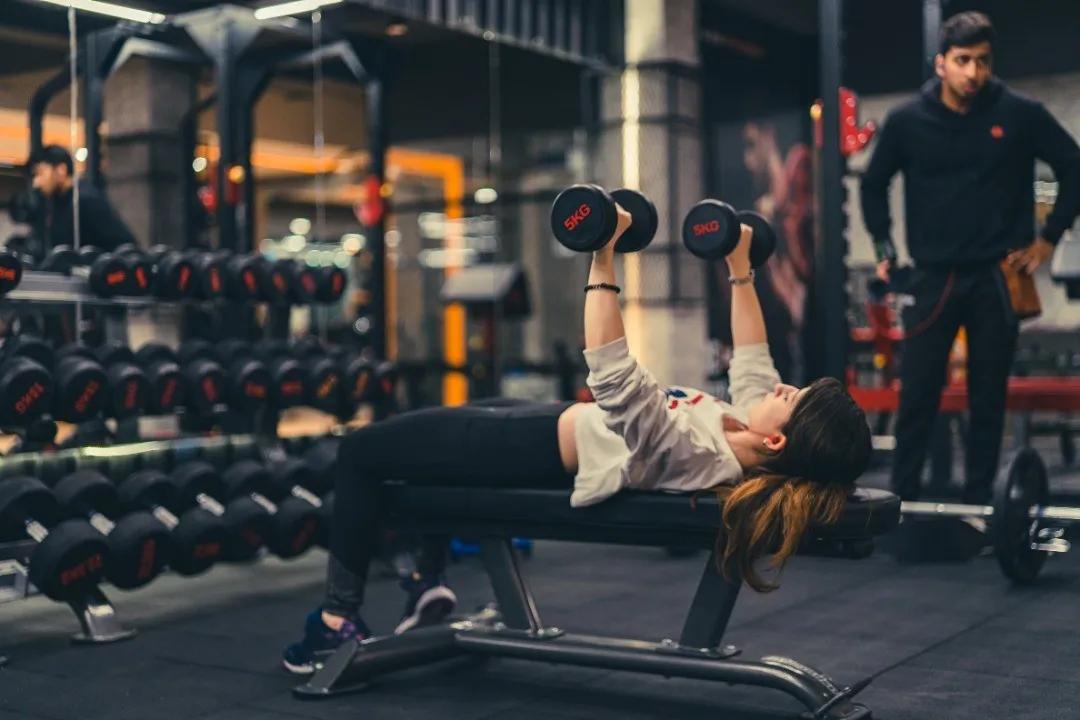 Member training with dumbbells at Game On Fitness Sarjapur Road